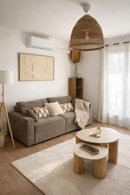 a living room with a couch and a table at Appartement 4 personnes 5 minutes a pieds du centre ville parking gratuit jardin 85m2 in LʼIsle-sur-la-Sorgue