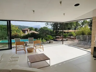 a living room with a couch and a table at Villa Cezanne Panorama, City Center on Foot in Aix-en-Provence