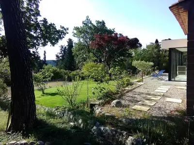 a garden with a tree and a house at Villa Cezanne Panorama, City Center on Foot in Aix-en-Provence