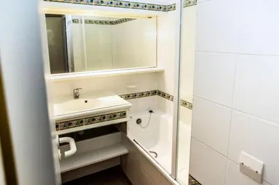a bathroom with a sink and a mirror at Village Pont Royal en Provence - maeva Home - Appartement 2 pièces 5 personnes - Sélection MAE-1083 in Mallemort