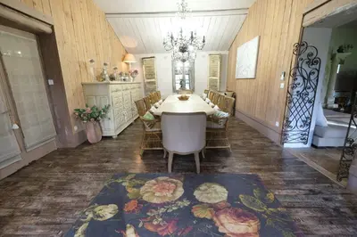 a dining room with a table and chairs at luxury farm jacuzzi heated pool in Isle sur la sorgue in Lagnes