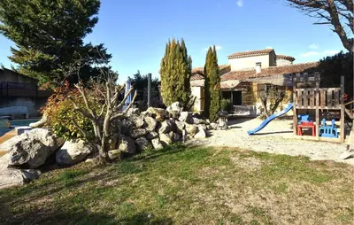 a yard with a playground and a slide at Maison Avec Piscine Privée in Entraigues-sur-la-Sorgue