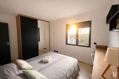 a bedroom with a bed with two towels on it at Villa Alberta Charming 10-person villa in Provence in Éguilles