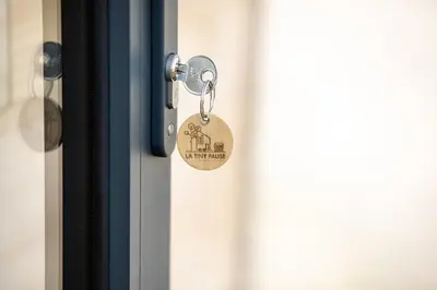 a lock on a door with a key at Tiny House Sainte Victoire - Brasserie Aix Pression in Rognes
