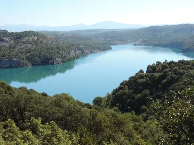 a view of a lake in the hills at Studios Nuitée en Provence in Aix-en-Provence