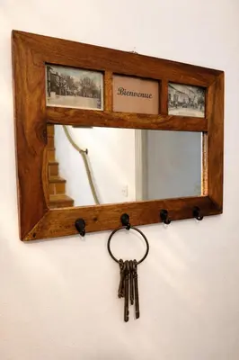 a group of keys hanging in front of a mirror at Mas Caumontois Provençal charm & private pool in Caumont-sur-Durance