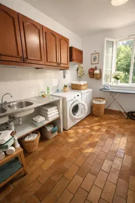 a kitchen with a washing machine and a sink at Mas Caumontois Provençal charm & private pool in Caumont-sur-Durance