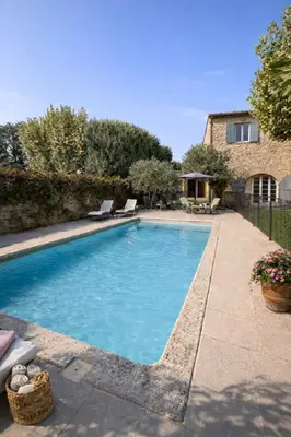 a swimming pool in a yard with a house at Mas Caumontois Provençal charm & private pool in Caumont-sur-Durance