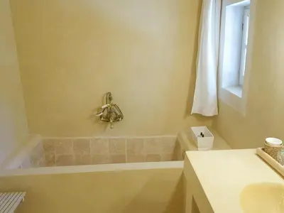 a bathroom with a tub and a sink at Provençal House With Pool Near Roussillon in Roussillon