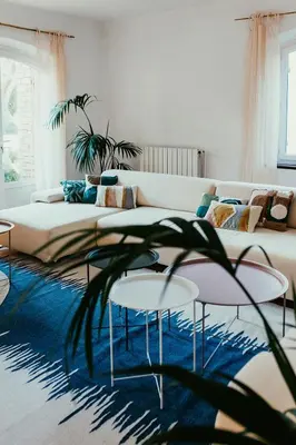 a living room with a couch and two tables at Provençal Villa At Domaine in Cornillon-Confoux