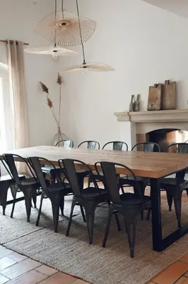 a dining room with a wooden table and chairs at Provençal Villa At Domaine in Cornillon-Confoux