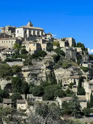 a village on top of a mountain at Family Stone House In Gordes in Gordes