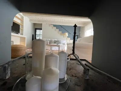 a room with a bunch of white candles on a table at L'ISLE SUR LA SORGUE - Maison de prestige in Saumane-de-Vaucluse
