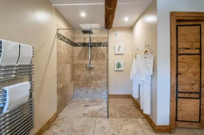 a bathroom with a shower and a glass shower stall at Wine Estate With Sunset Courtyard Near Bédoin in Mazan