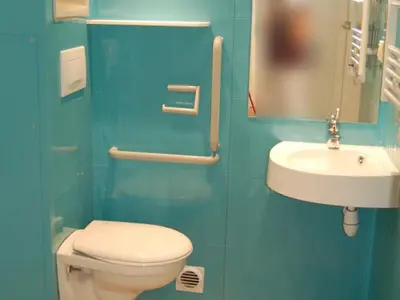 a bathroom with a toilet and a sink at Mobil Home PMR avec Terrasse à Cavaillon - API-1-52-1378 in Cavaillon