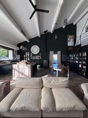a living room with a white couch and a table at Splendid Loft in Provence in Robion en Luberon