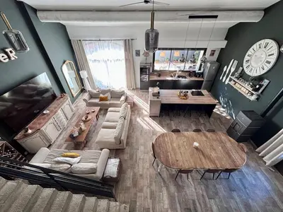 a living room with a couch and a table at Splendid Loft in Provence in Robion en Luberon