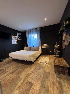 a bedroom with a bed and a wooden floor at Splendid Loft in Provence in Robion en Luberon
