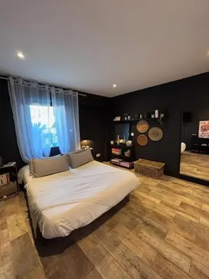a bedroom with a large white bed in a room at Splendid Loft in Provence in Robion en Luberon