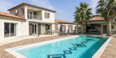 a swimming pool in front of a house at Villa Peyriere-Ventoux in Carpentras