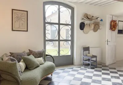 a living room with a couch and a window at 19Th-Century Mas With Pool And Garden Facing Luberon in Oppède