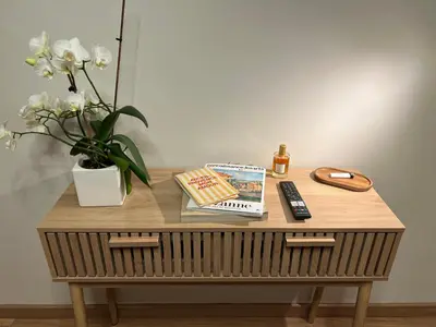 a bedroom with a bed and a table and chairs at Luméa 126 in Éguilles