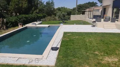 a swimming pool in the yard of a house at Villa la grande Bastide in Oppède