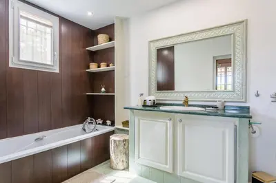 a bathroom with a sink and a mirror at Bastide Vallonia Luxury & Serenity in the Heart of the Luberon in Murs