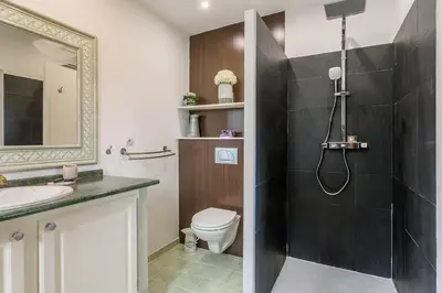 a bathroom with a shower and a toilet and a sink at Bastide Vallonia Luxury & Serenity in the Heart of the Luberon in Murs