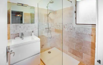 a bathroom with a shower and a sink at Maison Avec Piscine Privée in Mazan