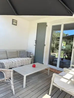 a table with plates of food and wine glasses at -La Garrigue Paradis-Maison de Vacances entièrement climatisée 5 chambres avec piscine-10 personnes in Rognes