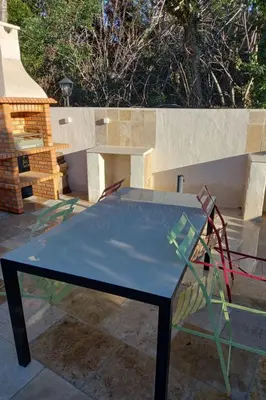 a blue ping pong table sitting on a patio at Apartment Gîte Moulin de Tartay by Interhome in Avignon