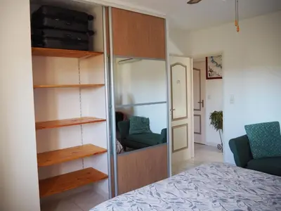 a bedroom with a closet and a bed in a room at Holiday Home by Interhome in Vernègues