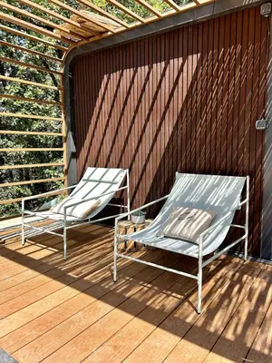 two chairs sitting on a wooden deck at Sous les étoiles du Luberon, Tiny House, Ménerbes in Ménerbes