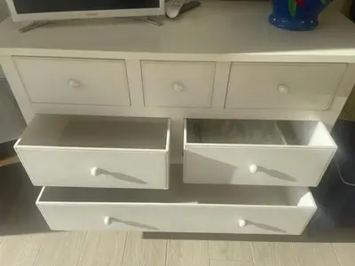 a white dresser with three drawers at 1 Brin à part in Maubec