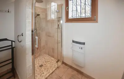 a bathroom with a shower and a toilet at Maison Avec Piscine 1 in Mormoiron