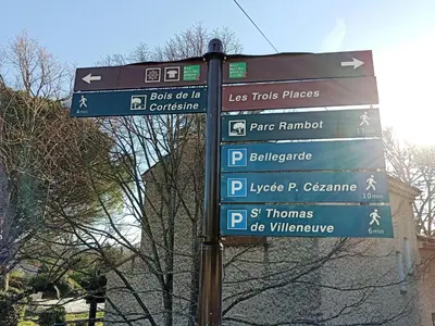 a street sign with many signs on a pole at Colocation 3 chambres - Prix pour 1 chambre - Proche centre-ville historique à pied in Aix-en-Provence