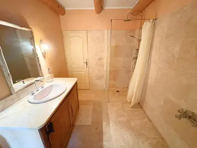 a bathroom with a sink and a shower at Le Mas des Poètes in Saint-Andiol