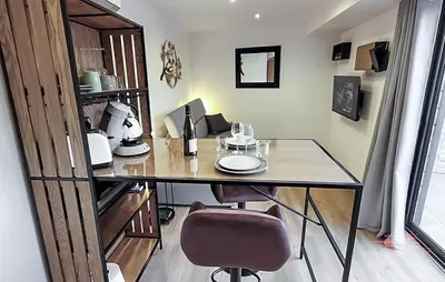 a room with a table and a chair in a room at Nice Home In Jonquerettes in Jonquerettes