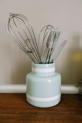 a white blender with a bunch of utensils in it at 