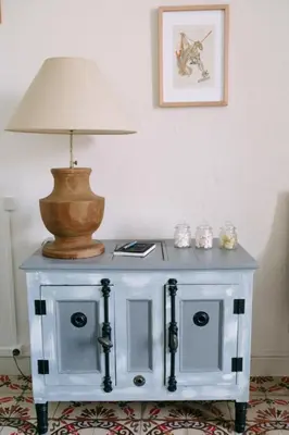 a table with a lamp on top of it at 
