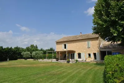 an old stone house with a large yard at Villa Ulysse - Tennis court and private pool in LʼIsle-sur-la-Sorgue