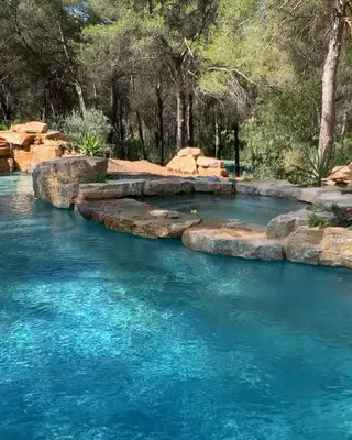 a river with blue water and trees in the background at Villa Luxury Lagoon - Aix en Provence in Ventabren