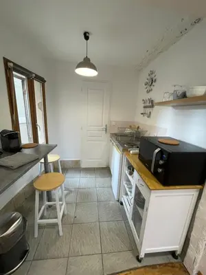 a kitchen with a counter with a microwave on it at Location studio centre ville Isle sur la sorgue in LʼIsle-sur-la-Sorgue