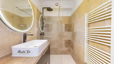 a bathroom with a sink and a mirror at gite de charme au pied du luberon avec piscine privée à Apt en Provence in Apt