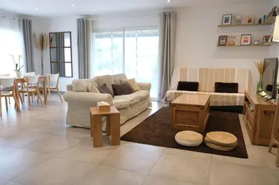 a living room with a couch and a table at Holiday rental with pool in the Alpilles for 6 people in Plan-dʼOrgon