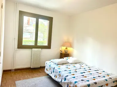 a bedroom with a bed and a window at Superbe T4 proche Aix centre ville avec clim et parking in Aix-en-Provence