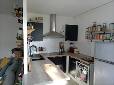 a kitchen with a sink and a refrigerator at T2 lumineux balcon, parking facile, climatisation, Wi-Fi in Aix-en-Provence