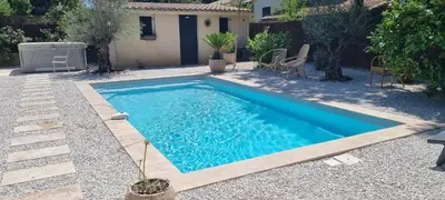 a swimming pool in the backyard of a house at Havre de paix avec piscine & spa - proche Ventoux in Saint-Didier