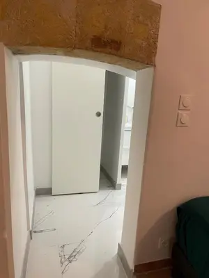 a room with a door and a tile floor at plaisir de vacances in Aix-en-Provence